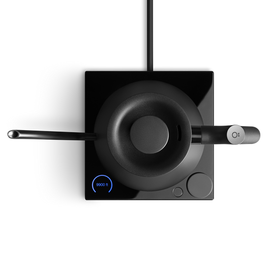 Modern black kitchen faucet with digital display on a white background